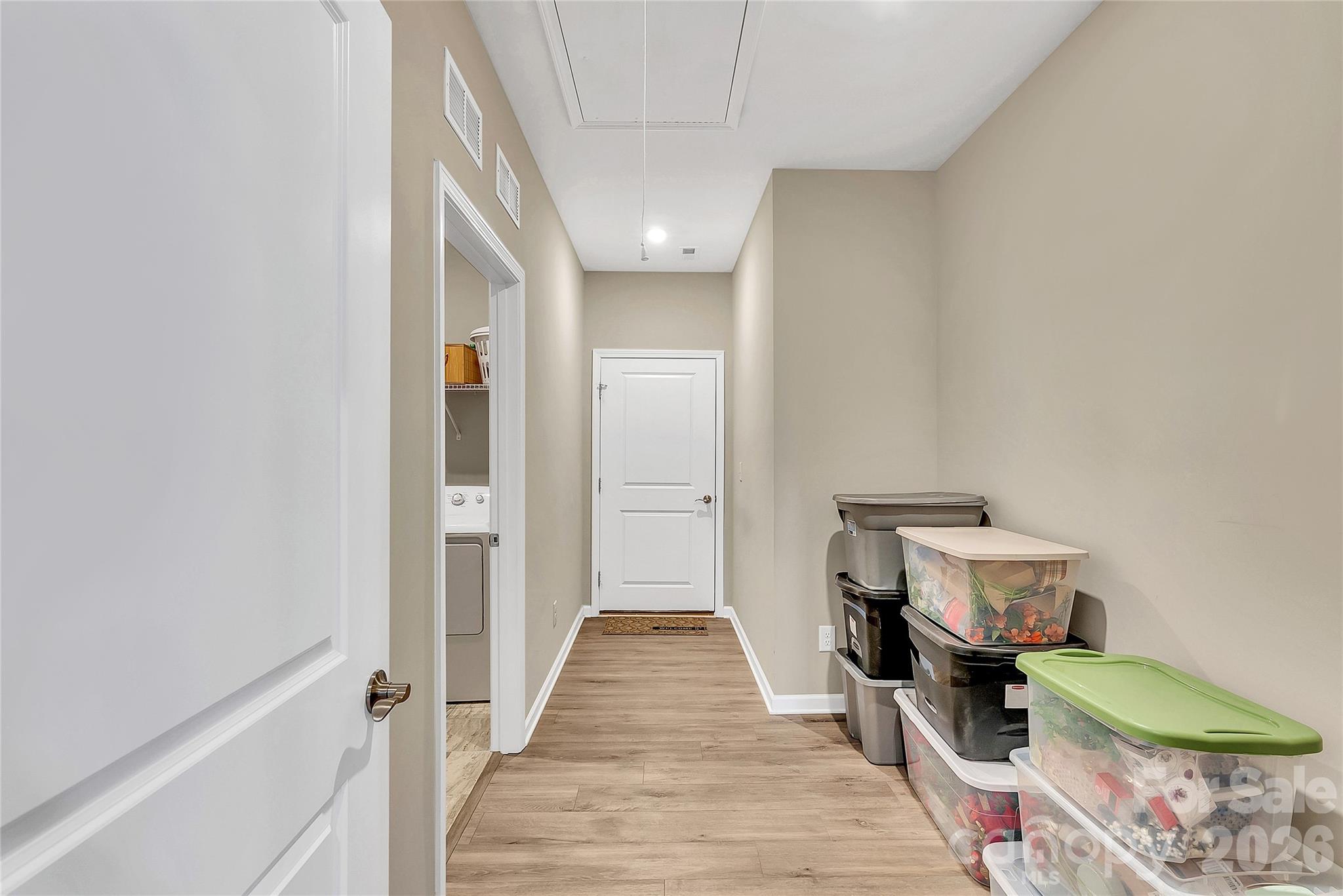 14421 Holbrooks Road Huntersville, NC 28078 - Photo 18 of 29 a view of a hallway with wooden floor and a bathroom
