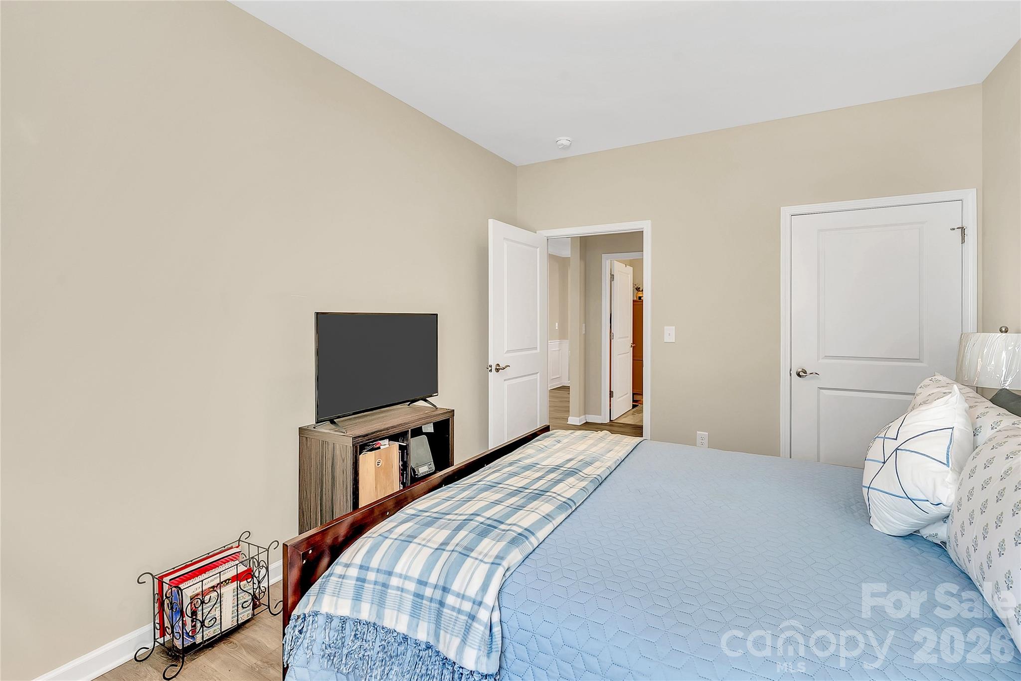14421 Holbrooks Road Huntersville, NC 28078 - Photo 20 of 29 a bedroom with a bed and a flat screen tv