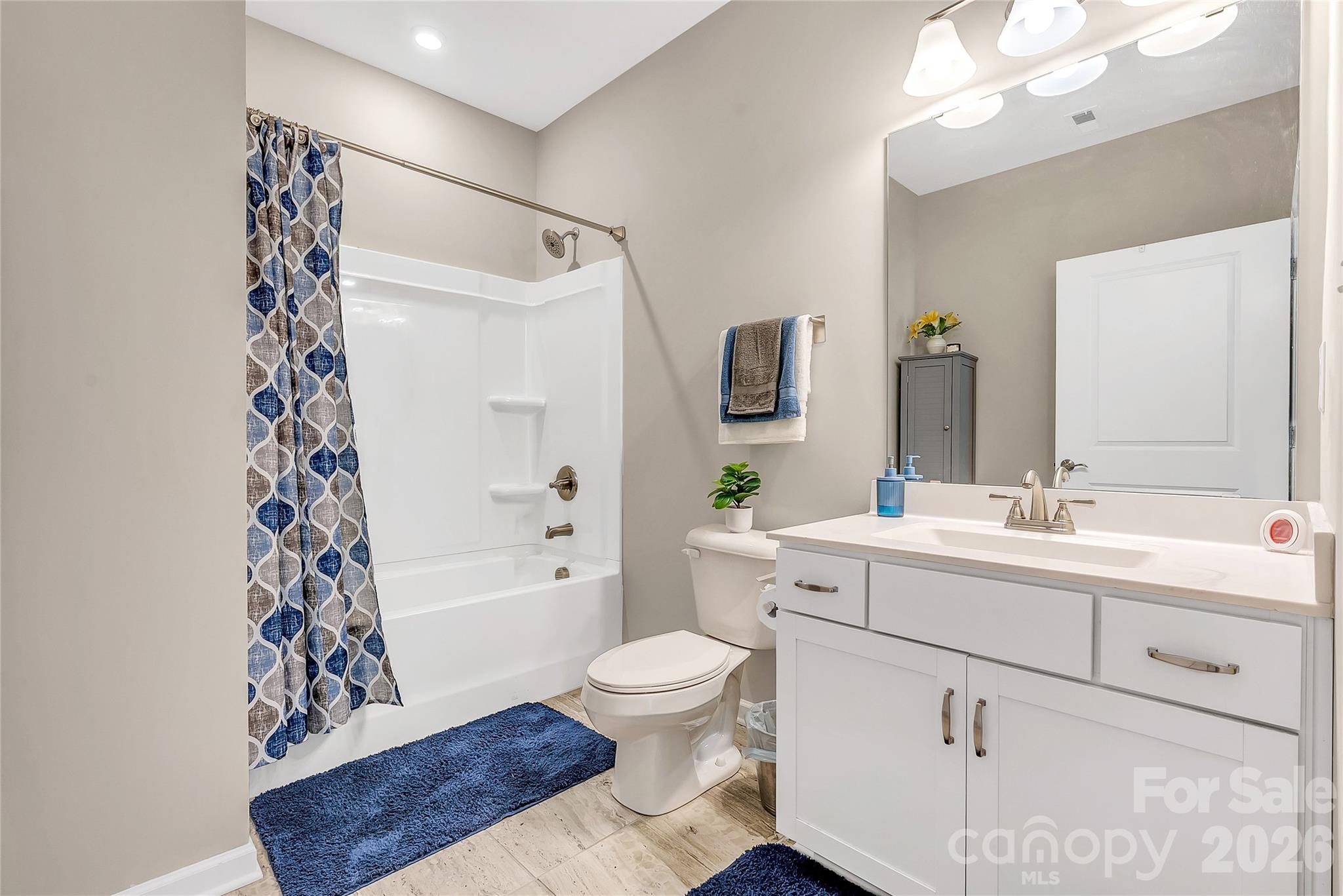 14421 Holbrooks Road Huntersville, NC 28078 - Photo 22 of 29 a bathroom with a sink a toilet and shower