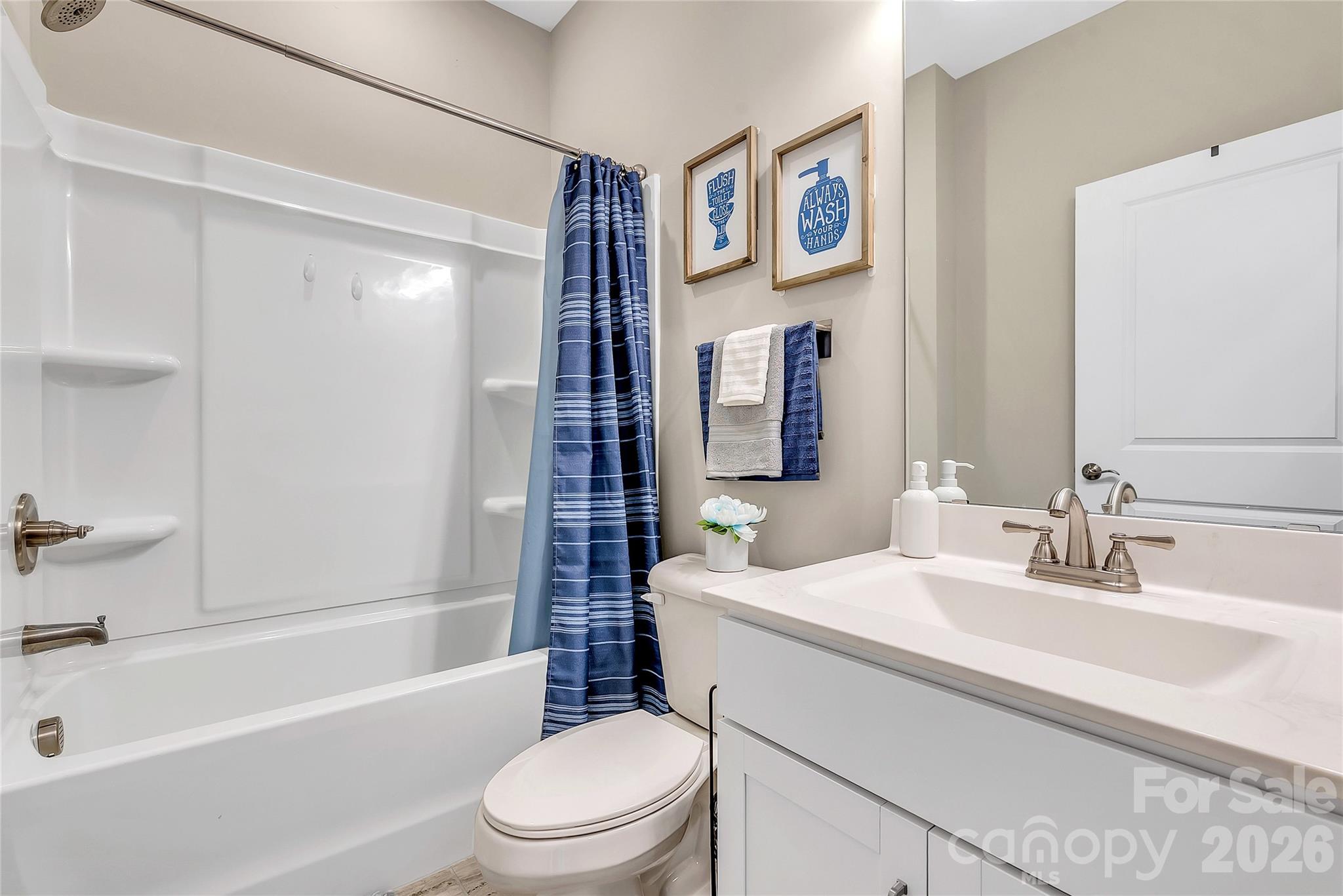 14421 Holbrooks Road Huntersville, NC 28078 - Photo 23 of 29 a bathroom with a sink a toilet and shower