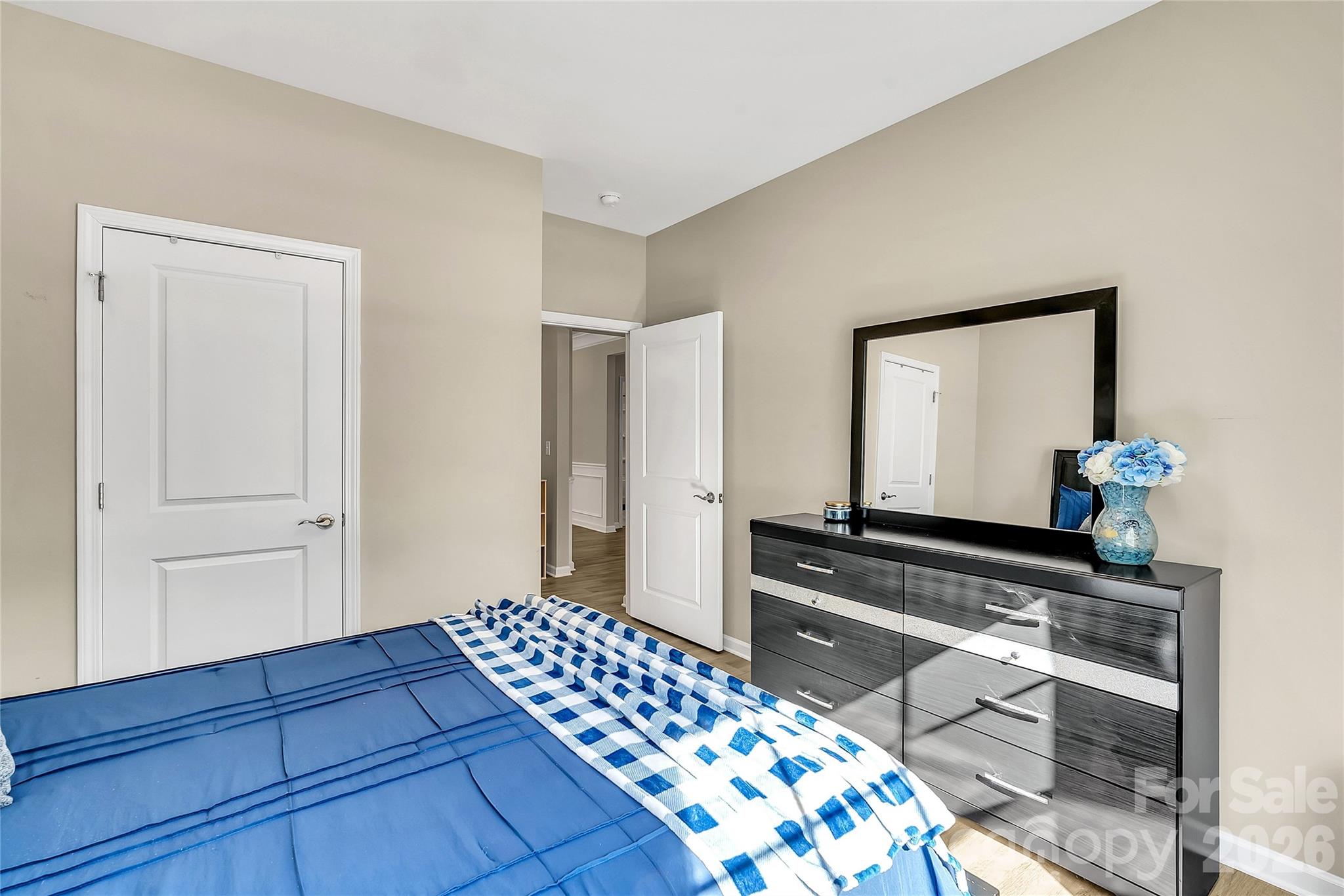 14421 Holbrooks Road Huntersville, NC 28078 - Photo 24 of 29 a bedroom with a bed and a mirror on dresser