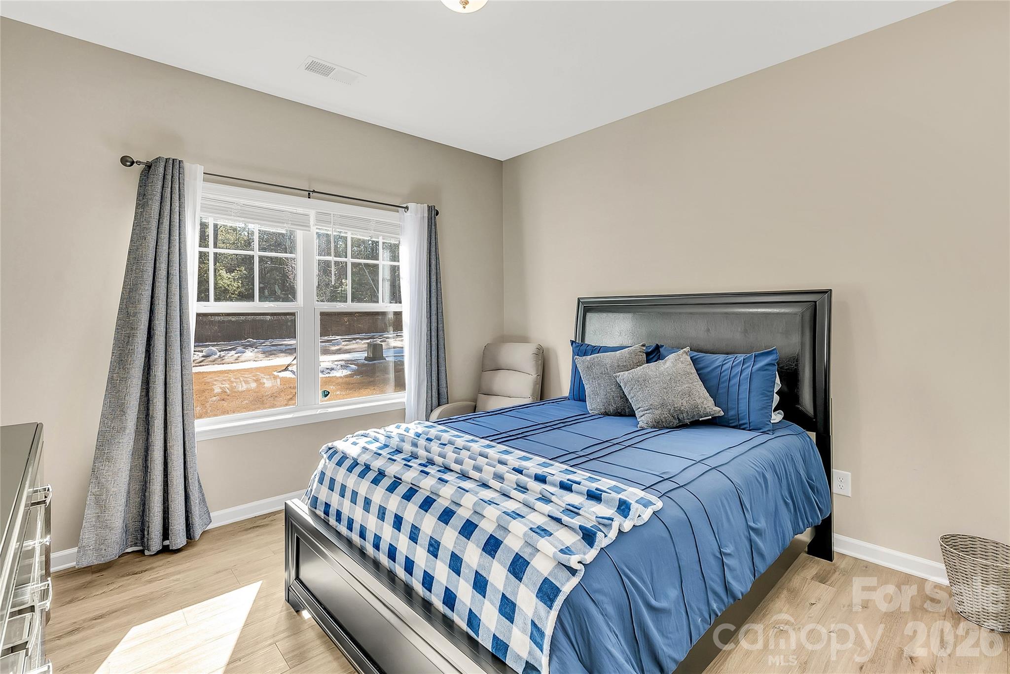 14421 Holbrooks Road Huntersville, NC 28078 - Photo 25 of 29 a bedroom with a large bed and a window