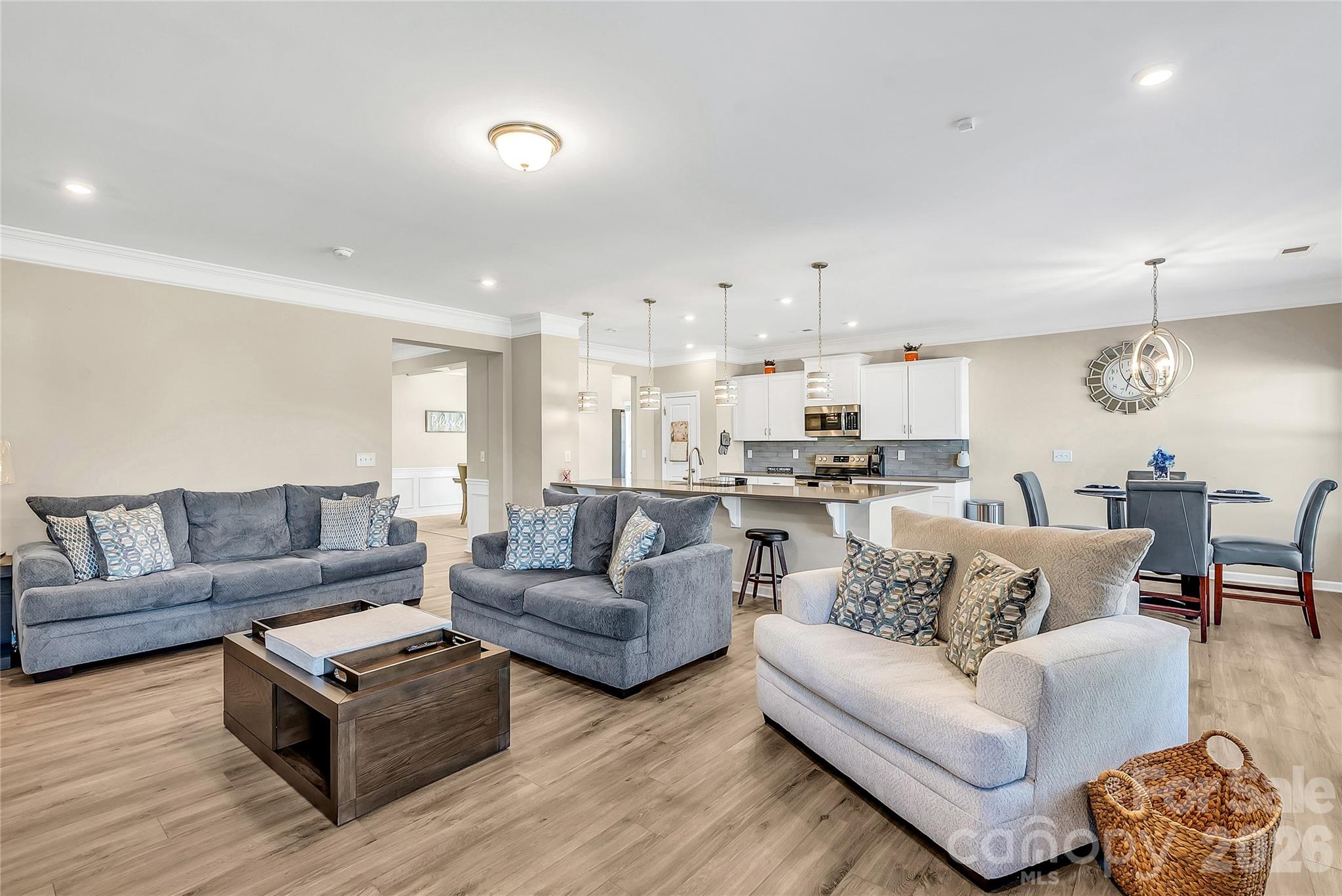 14421 Holbrooks Road Huntersville, NC 28078 - Photo 7 of 29 a living room with furniture and kitchen view