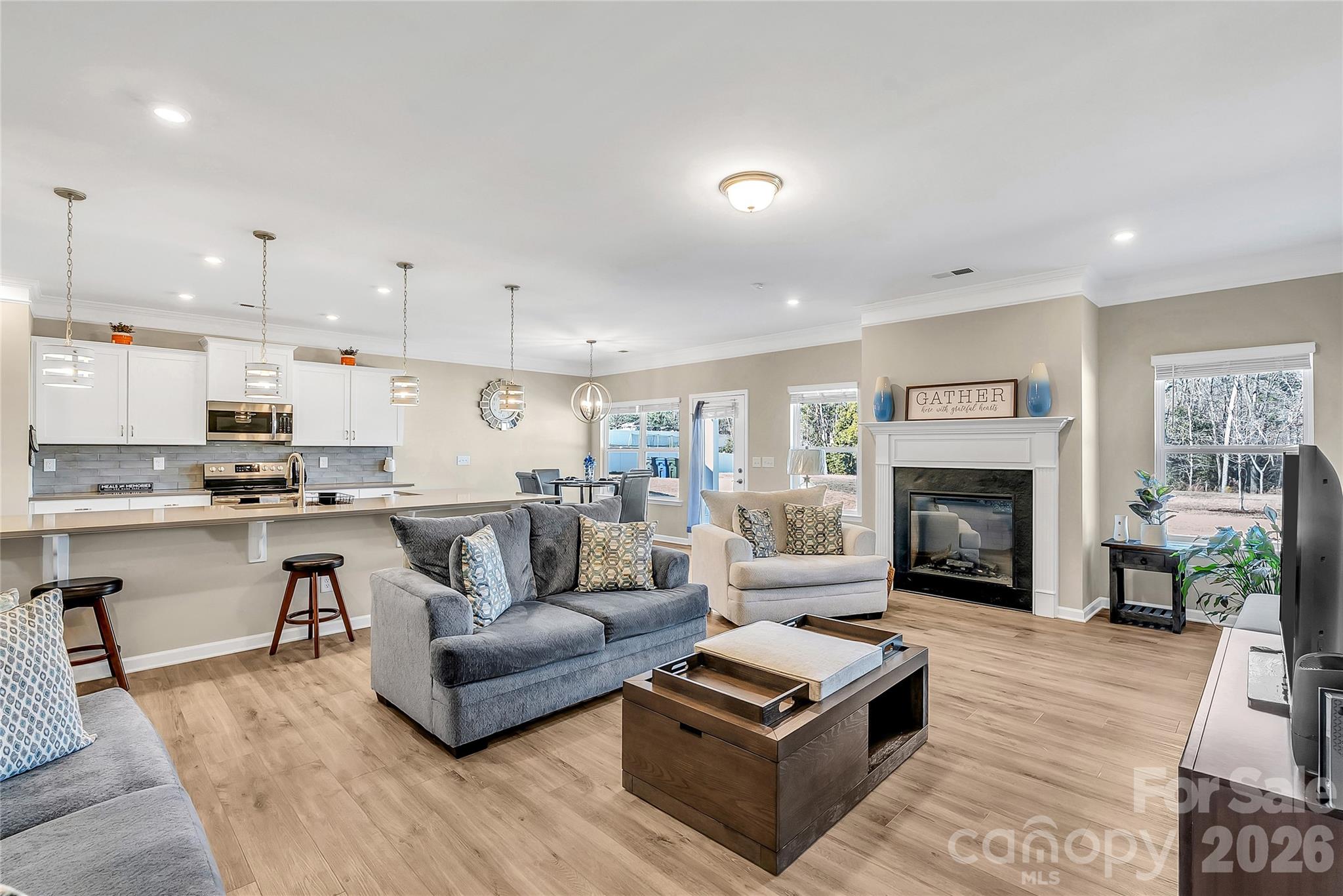 14421 Holbrooks Road Huntersville, NC 28078 - Photo 8 of 29 a living room with furniture and a fireplace