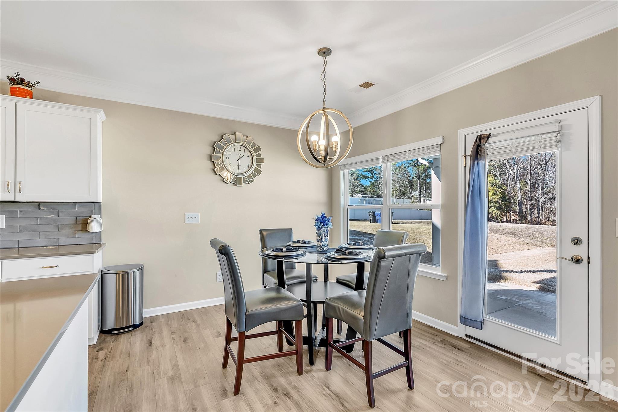14421 Holbrooks Road Huntersville, NC 28078 - Photo 10 of 29 a view of a dining room with furniture window and wooden floor