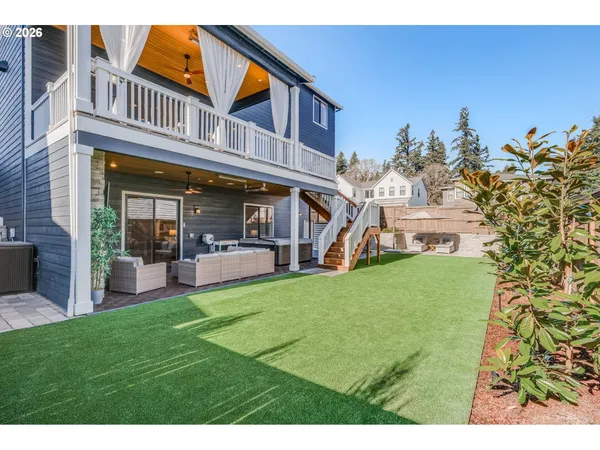 a view of a house with a yard porch and sitting area