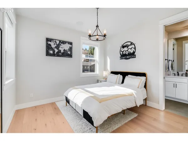 a bedroom with a bed and a view of bathroom