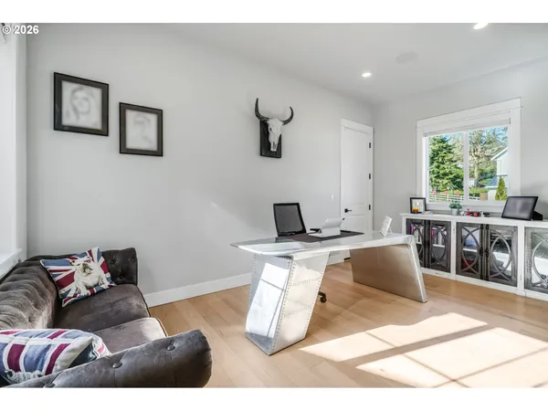 a living room with furniture a window and a table
