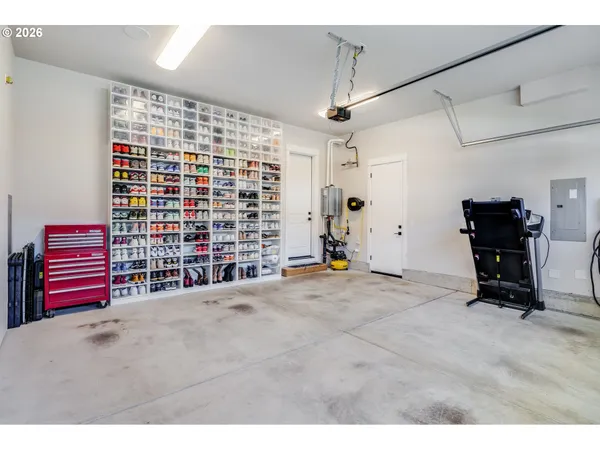 a view of an empty room with a ceiling fan