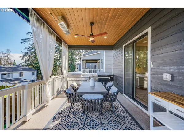a view of a patio with a table and chairs