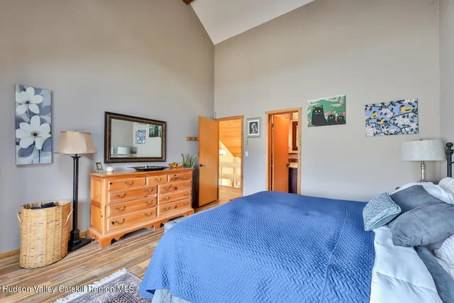 a bathroom with a toilet a sink and a mirror
