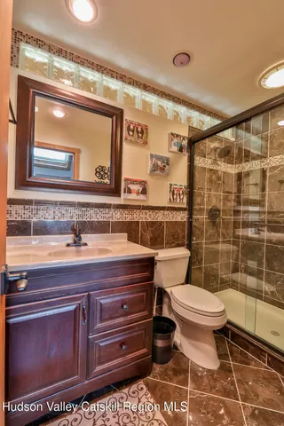 a view of a room with wooden walls