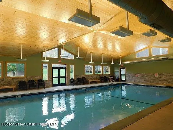 a view of swimming pool with an outdoor seating