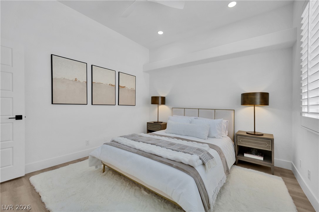 8981 Rivers Edge Drive Las Vegas, NV 89117 - Photo 41 of 69 A well-lit bedroom with modern design elements awaits your personal touch.