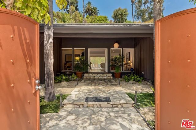 a view of house with yard