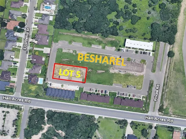 a view of a street with a sign on the wall