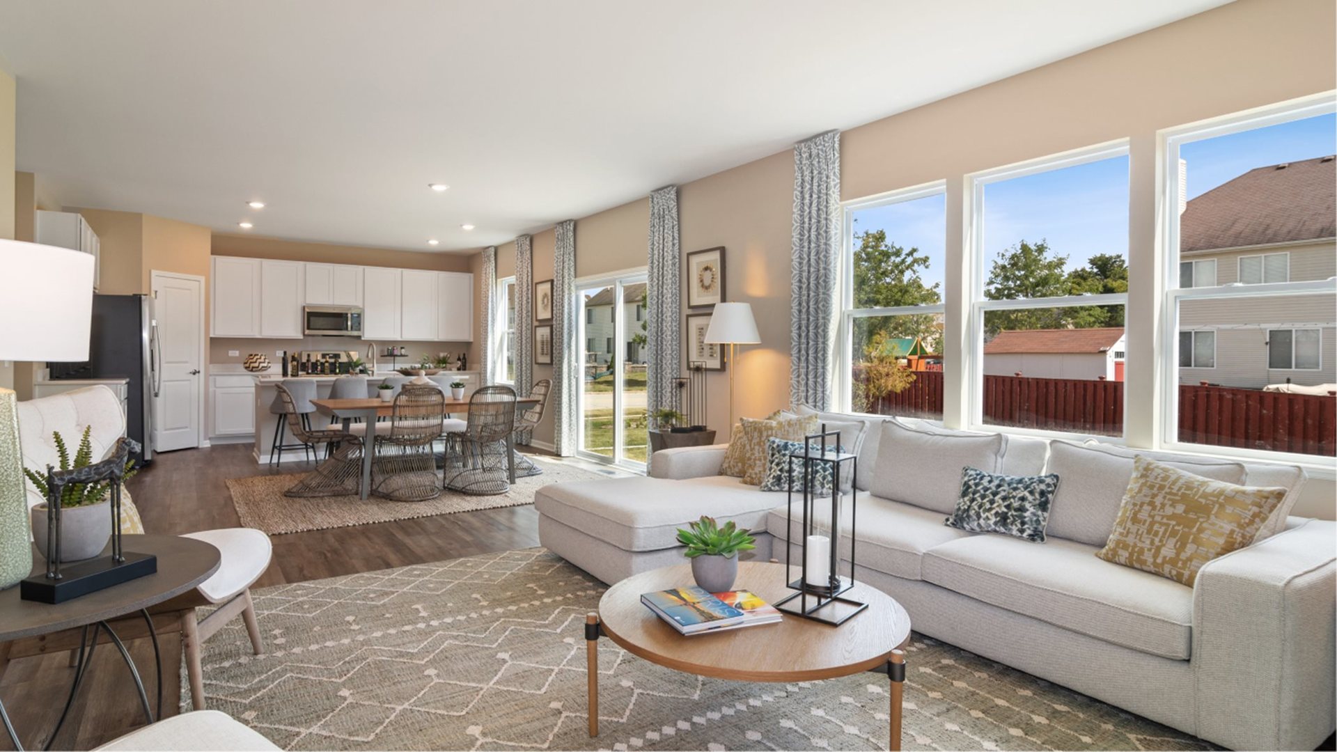 386 Danforth Drive Oswego, IL 60543 - Photo 6 of 14 a living room with furniture kitchen view and a large window