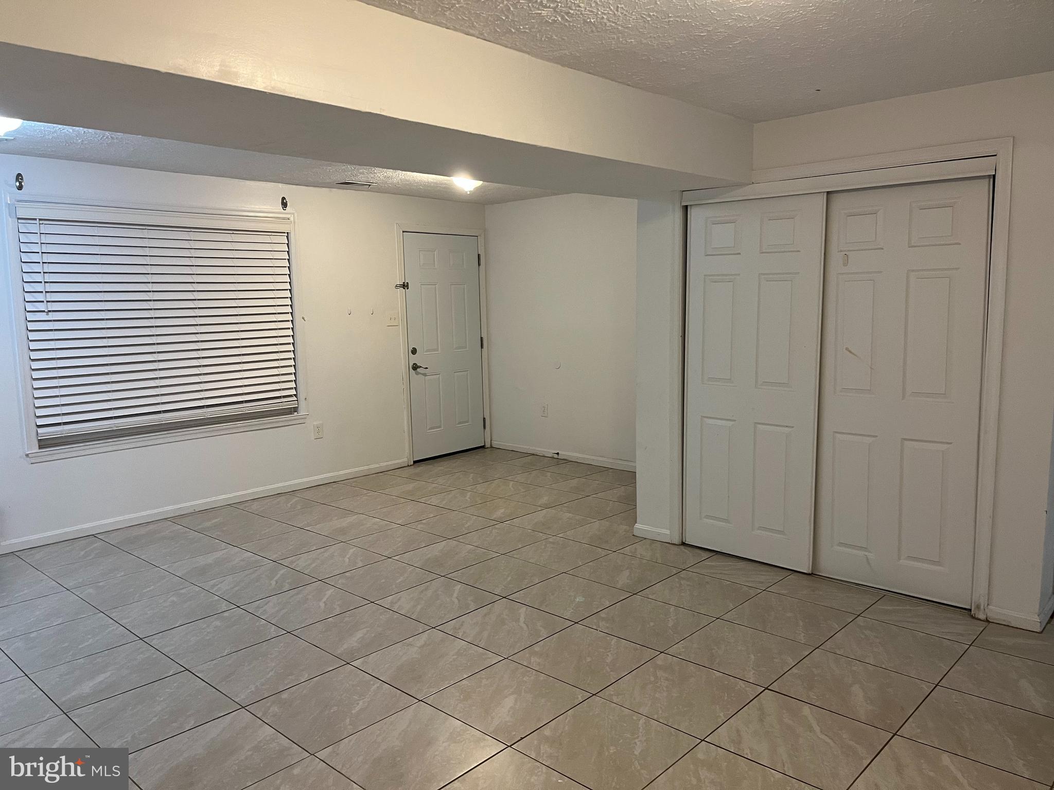 14684 Cloverdale Road Woodbridge, VA 22193 - Photo 6 of 10 a view of an empty room and a window