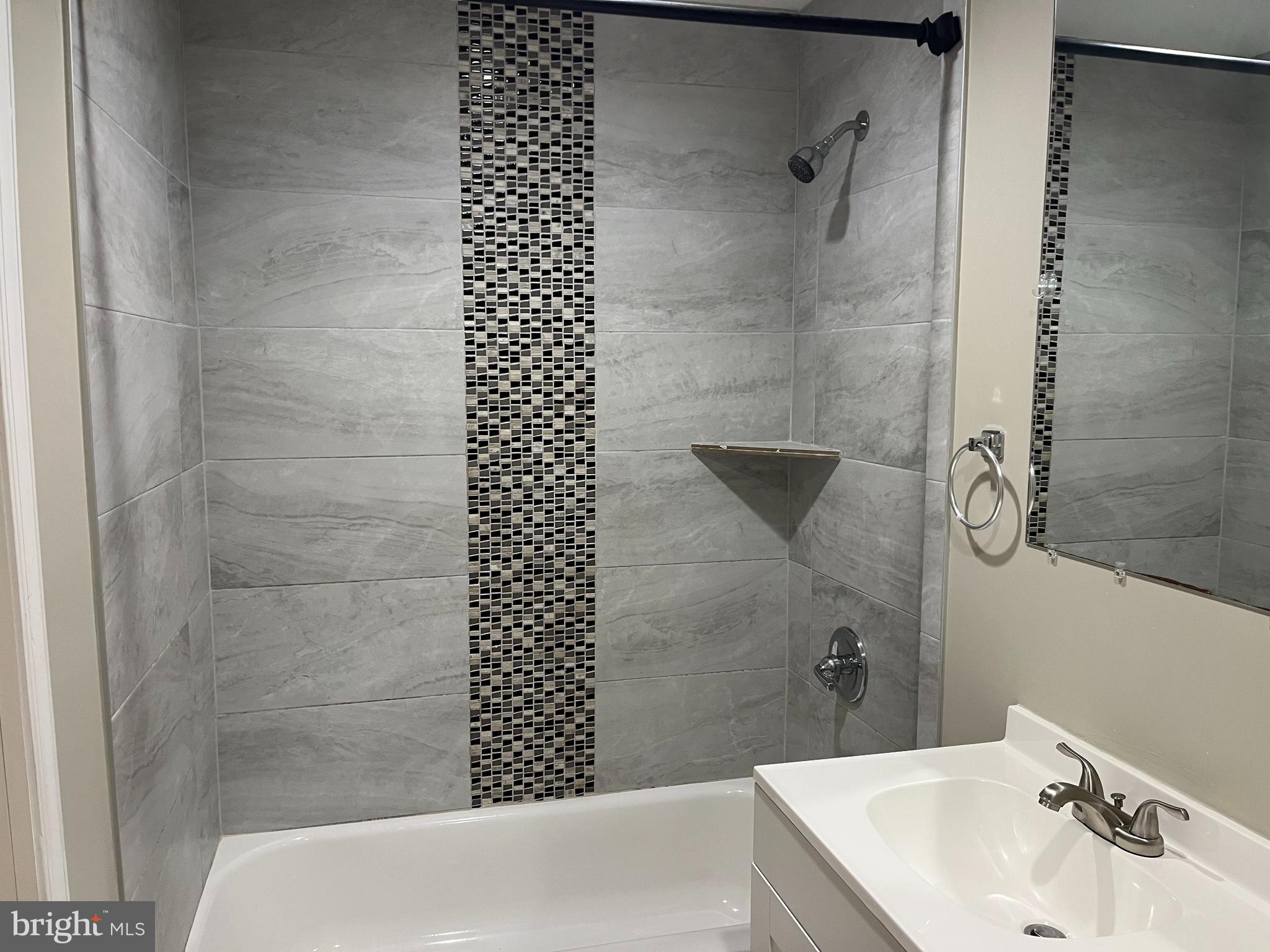 14684 Cloverdale Road Woodbridge, VA 22193 - Photo 8 of 10 a bathroom with a sink and shower
