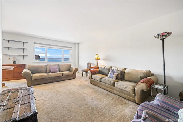 a bedroom with furniture and a flat screen tv