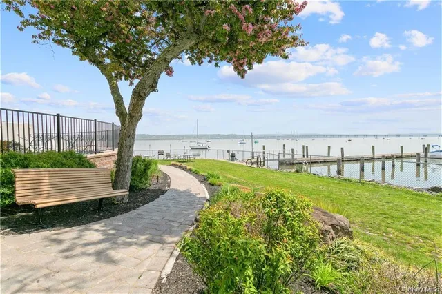a living room with fireplace furniture and a chandelier