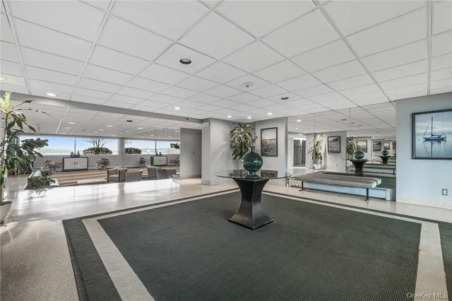 a view of a balcony with wooden floor and iron stairs