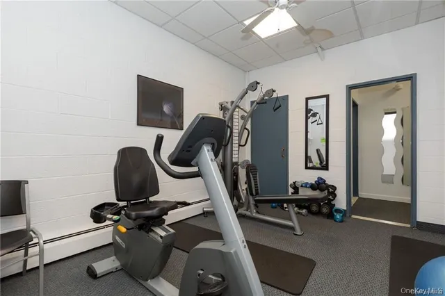 a room with pool table and windows