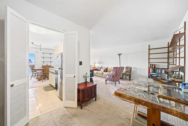 a living room with furniture and a table
