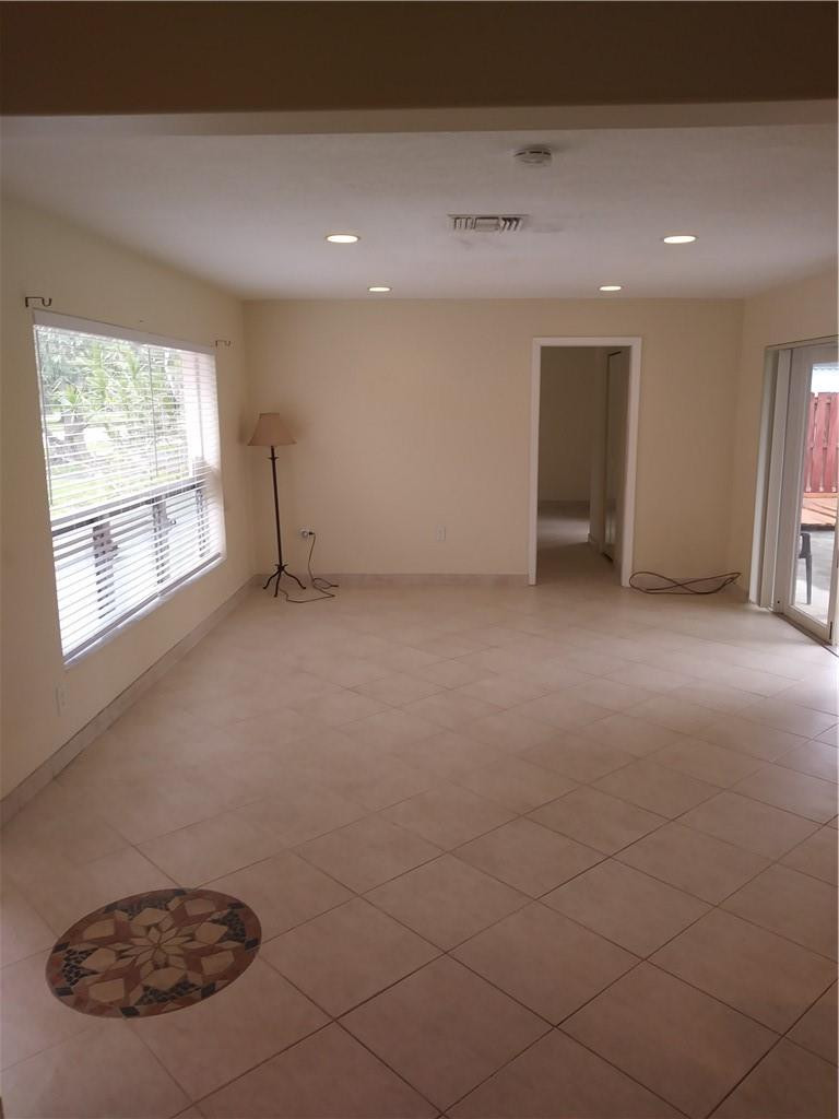 4508 West Park Road Hollywood, FL 33021 - Photo 3 of 13 an empty room with a empty space and windows