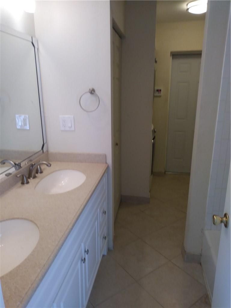 4508 West Park Road Hollywood, FL 33021 - Photo 9 of 13 a bathroom with a sink and a mirror