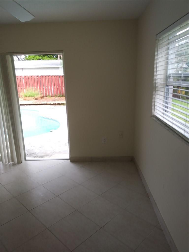 4508 West Park Road Hollywood, FL 33021 - Photo 10 of 13 an empty room with a window