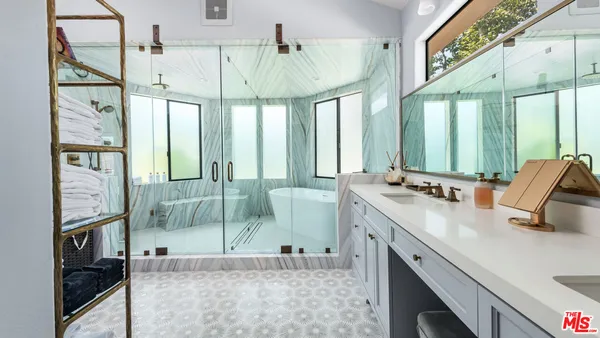 a bedroom with a large bed and a couch