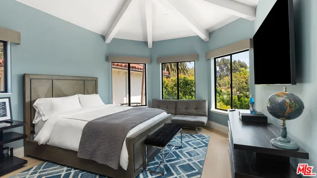 a bathroom with a sink and mirror with toilet