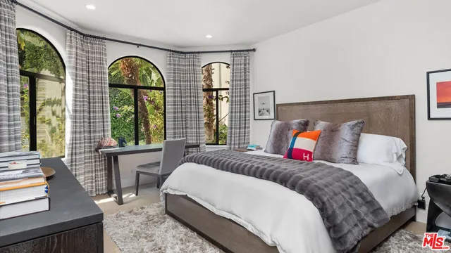 a bathroom with a granite countertop sink mirror and shower