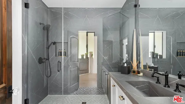 a view of an outdoor sitting area with furniture and wooden floor