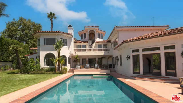 a view of the house with patio porch and tables