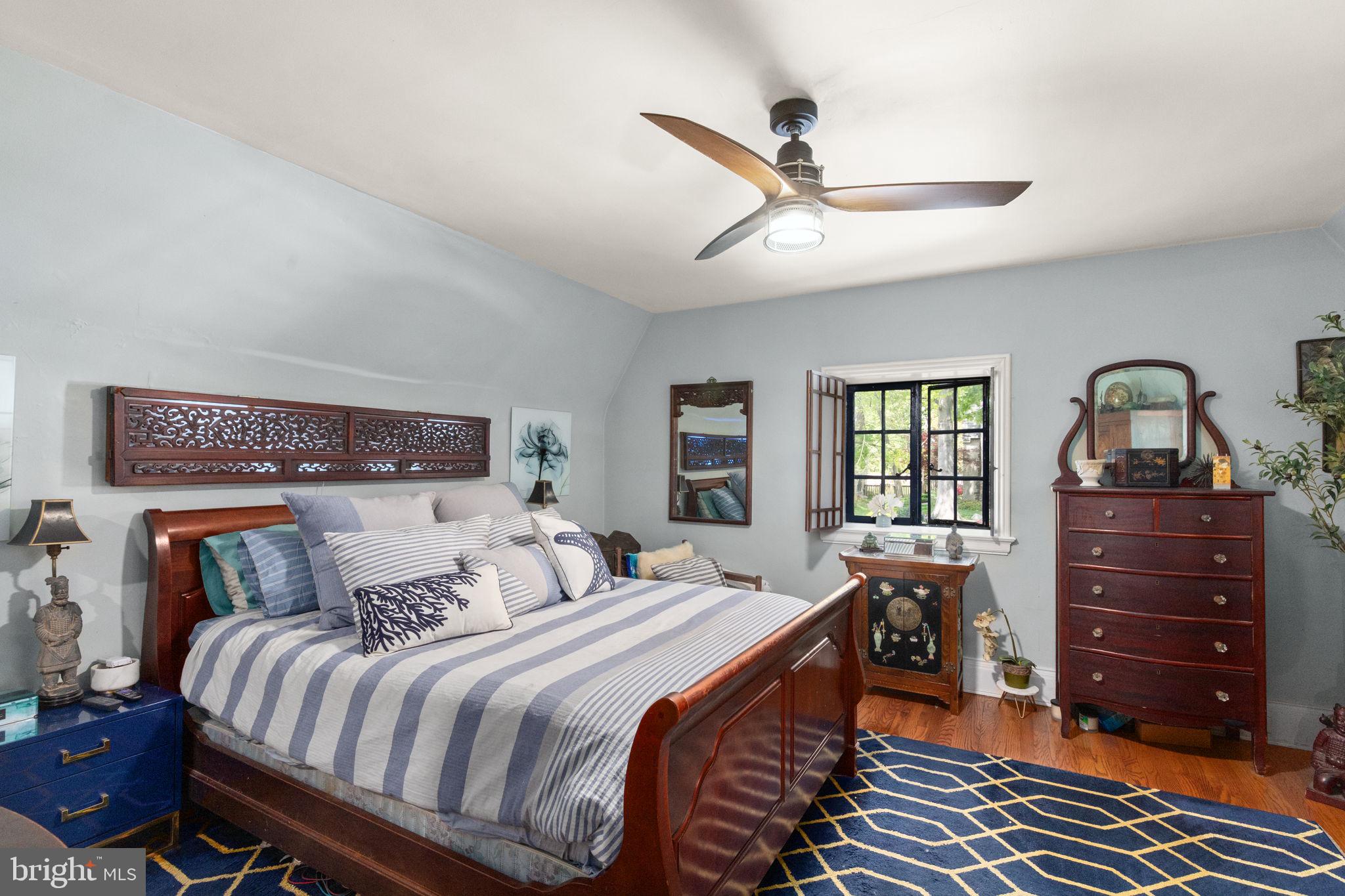 311 Taplow Road Baltimore, MD 21212 - Photo 23 of 32 a bedroom with a bed and a dresser