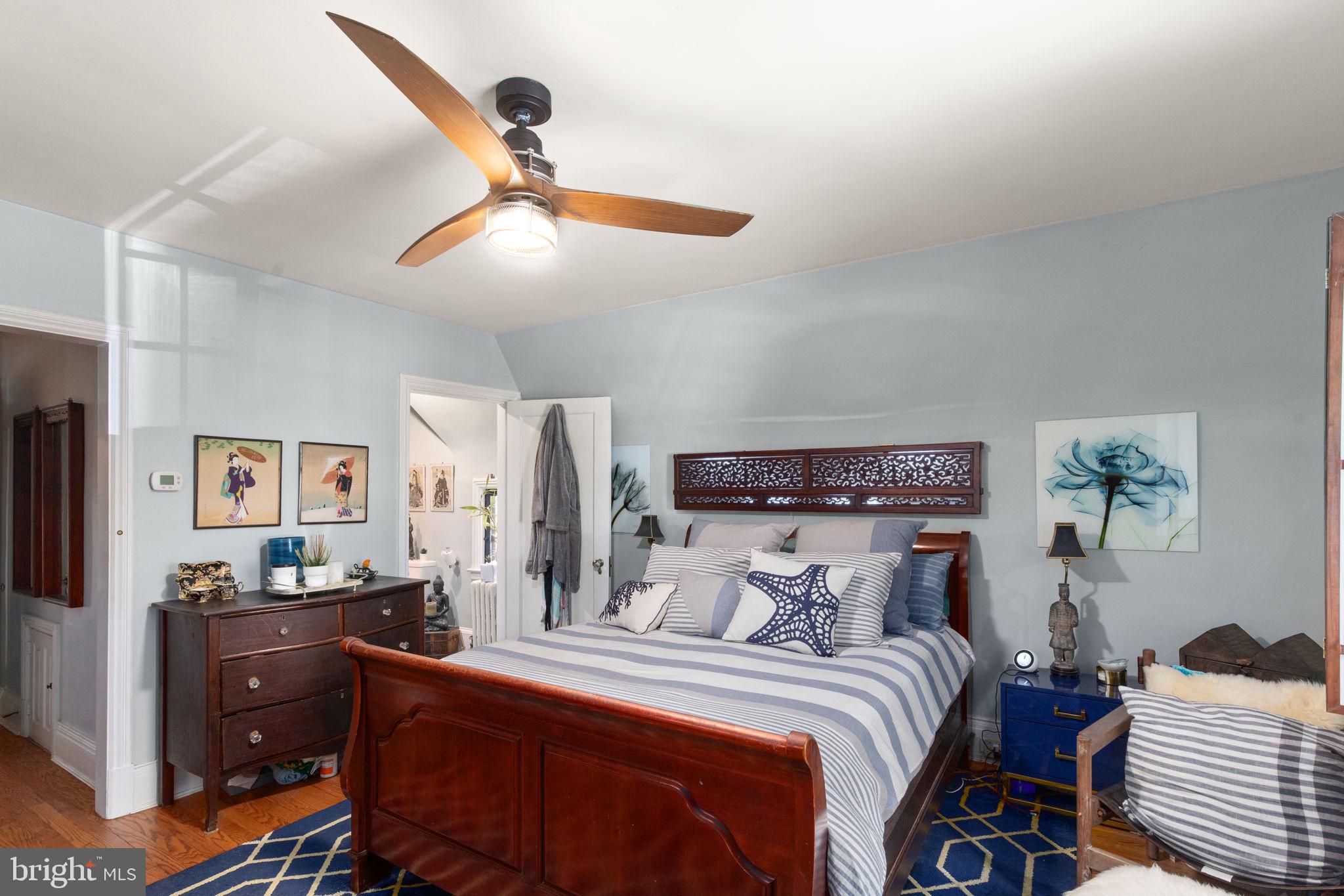 311 Taplow Road Baltimore, MD 21212 - Photo 24 of 32 a bedroom with a bed and a chandelier