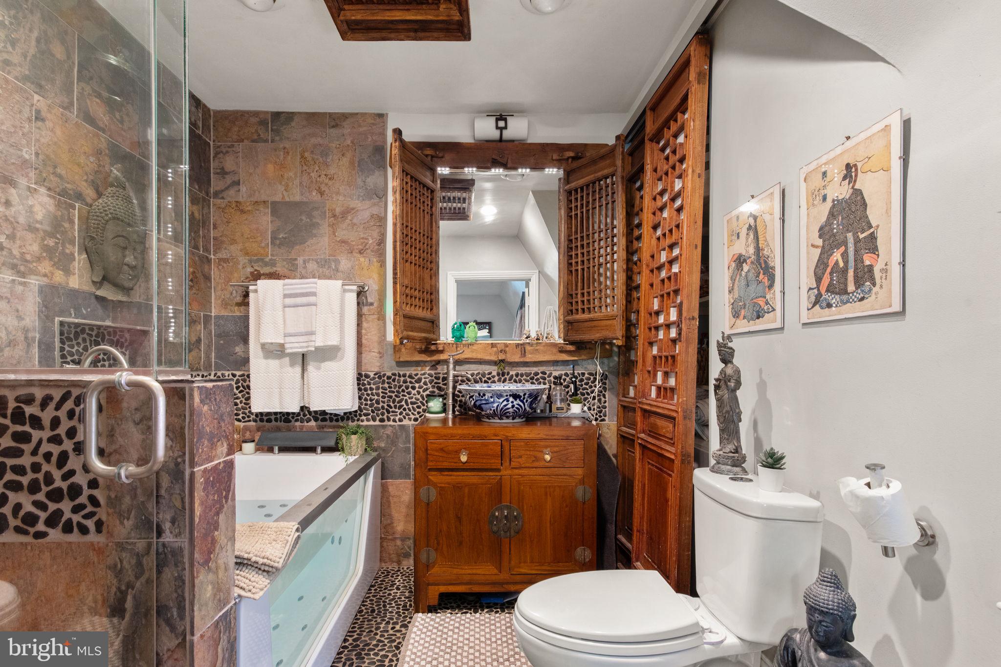 311 Taplow Road Baltimore, MD 21212 - Photo 25 of 32 a bathroom with a sink toilet vanity and shower
