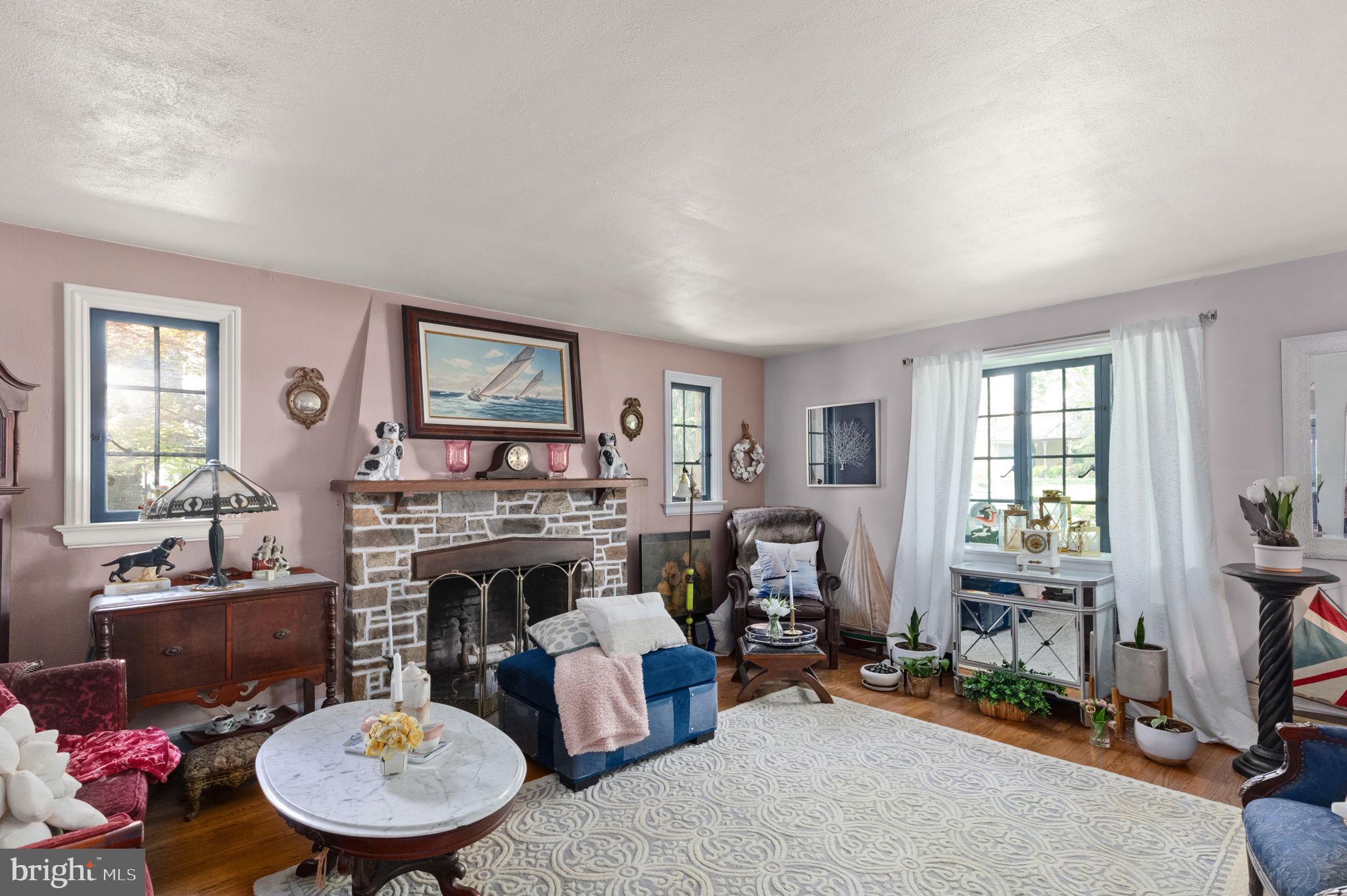 311 Taplow Road Baltimore, MD 21212 - Photo 6 of 32 a living room with furniture and a fireplace