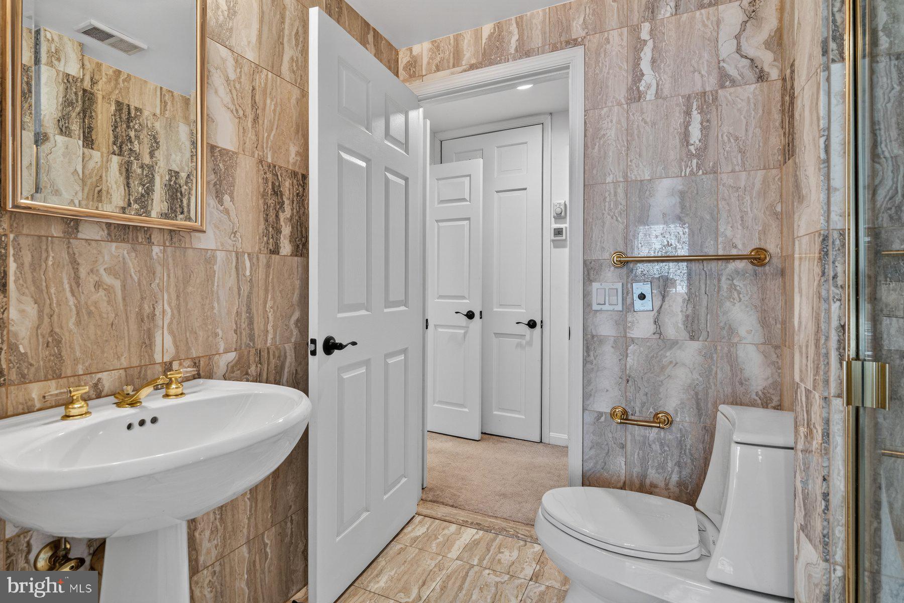 3801 Canterbury Road, Unit 403 Baltimore, MD 21218 - Photo 13 of 25 Elegant bathroom with marble accents.