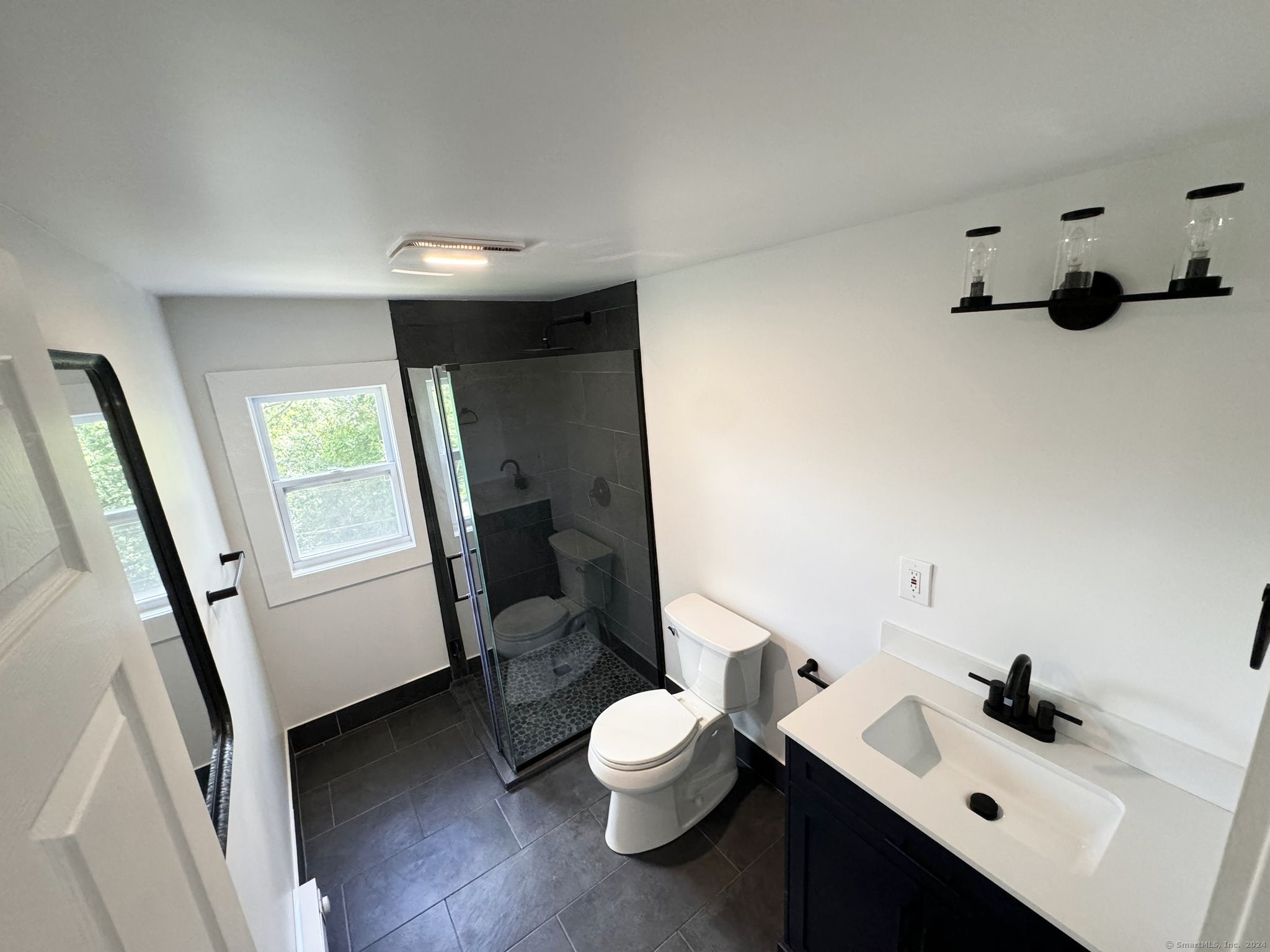 22 Hemlock Trail Newtown, CT 06482 - Photo 19 of 31 a bathroom with a sink a toilet and a tub