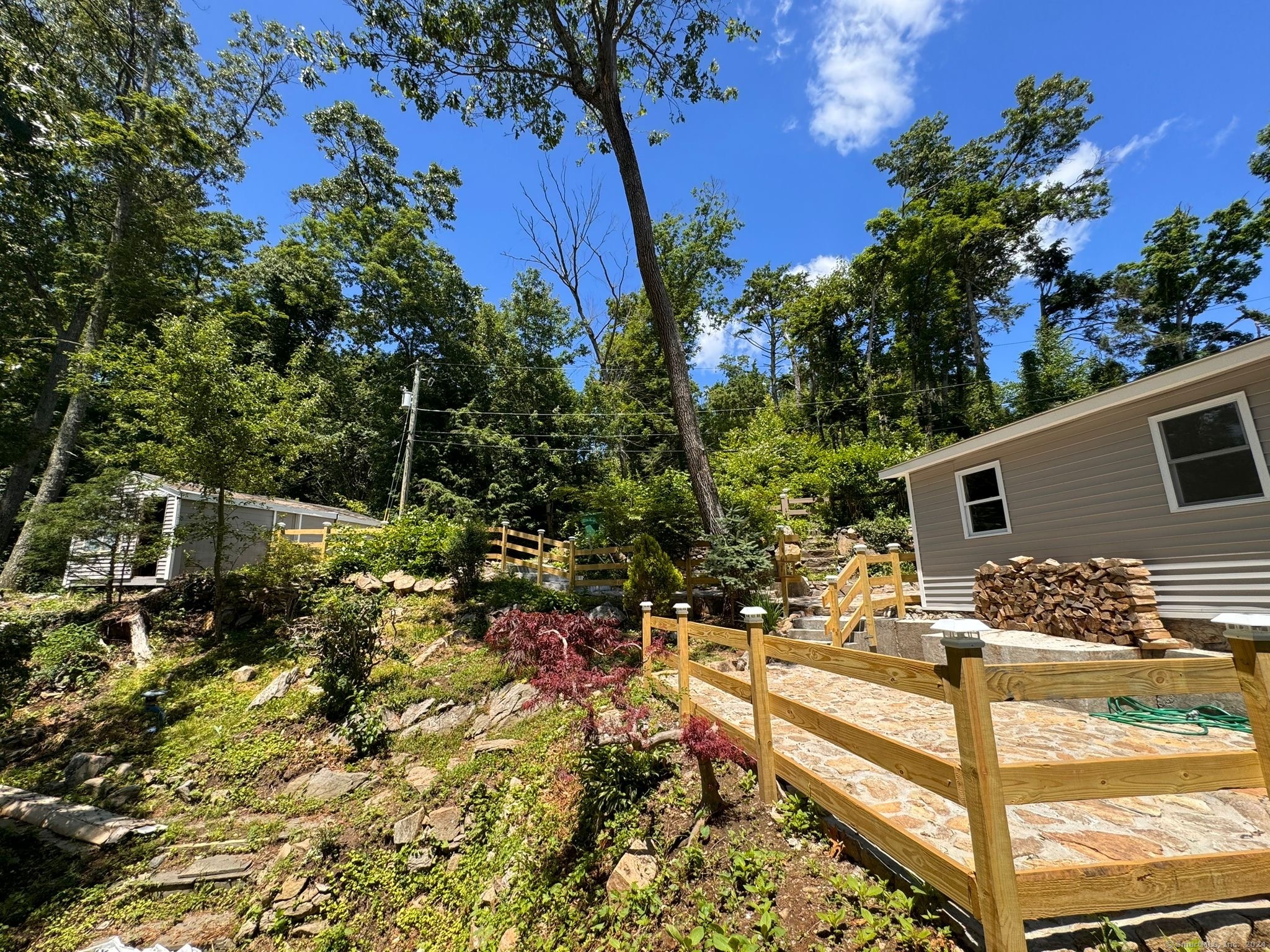 22 Hemlock Trail Newtown, CT 06482 - Photo 2 of 31 a view of house with backyard and trees