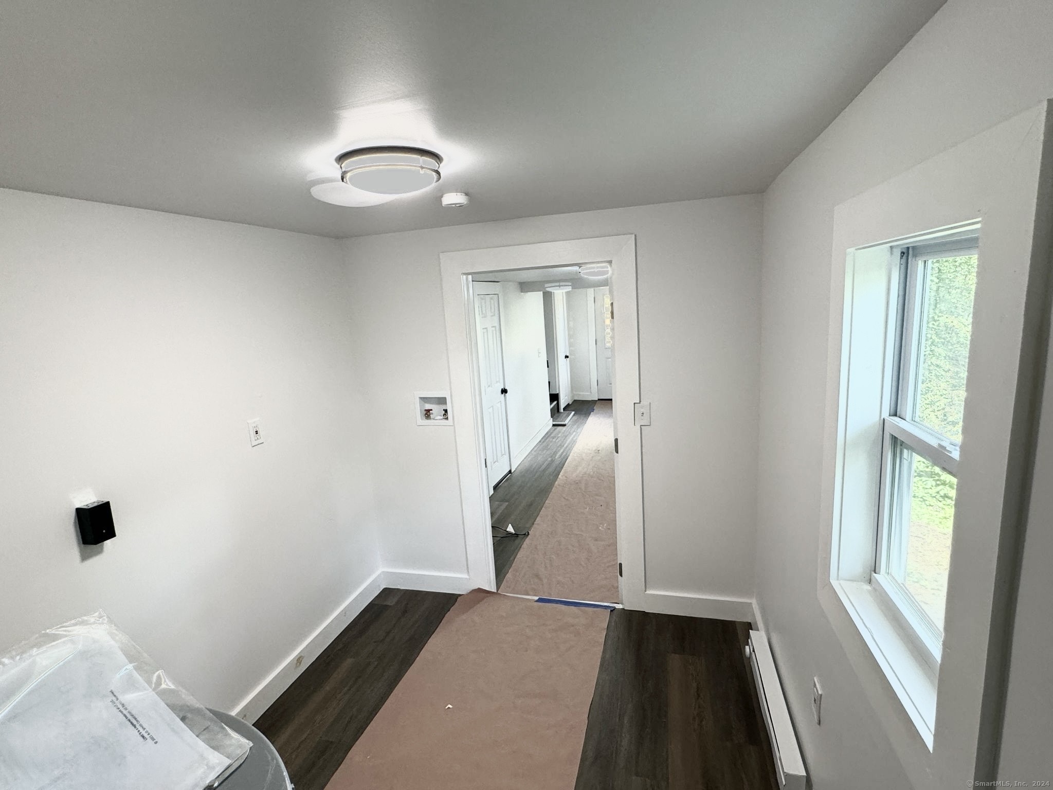 22 Hemlock Trail Newtown, CT 06482 - Photo 26 of 31 wooden floor in an empty room with a window
