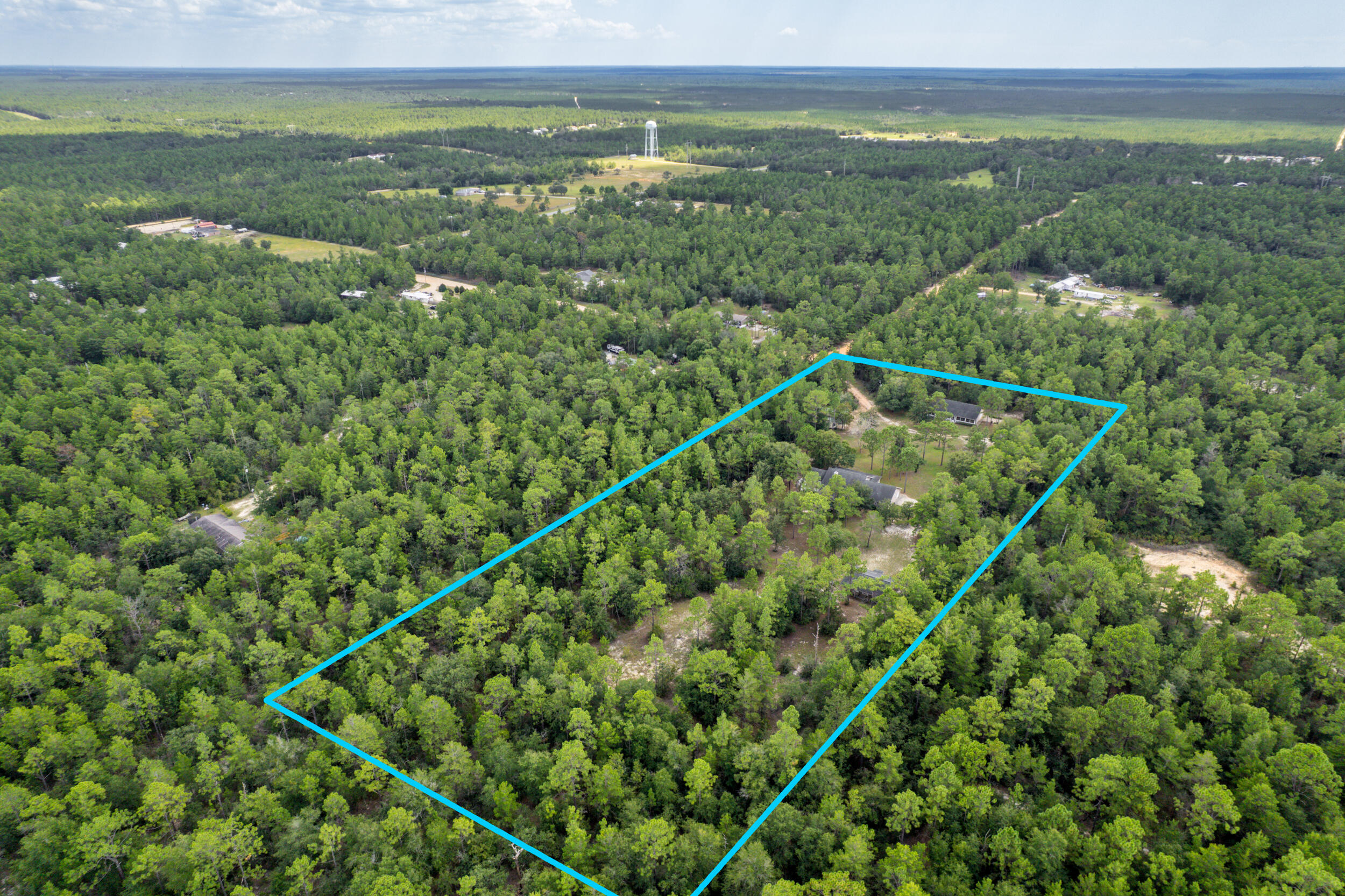 5378 Staghorn Road Crestview, FL 32539 - Photo 127 of 130 a view of a city with lush green forest