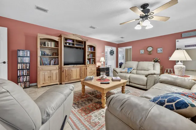 a bathroom with a toilet a sink and a window
