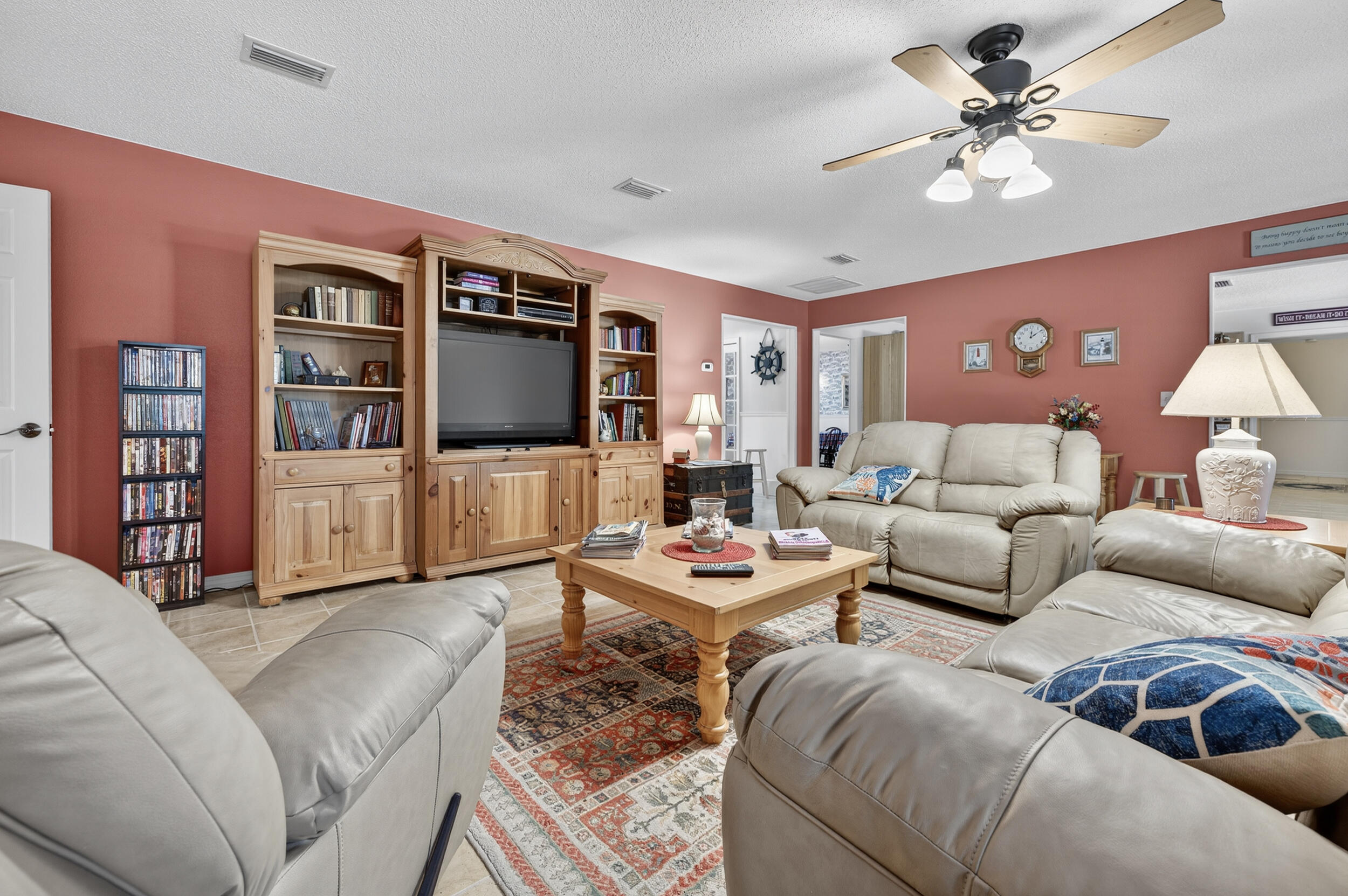 5378 Staghorn Road Crestview, FL 32539 - Photo 16 of 130 a living room with furniture ceiling fan and a flat screen tv