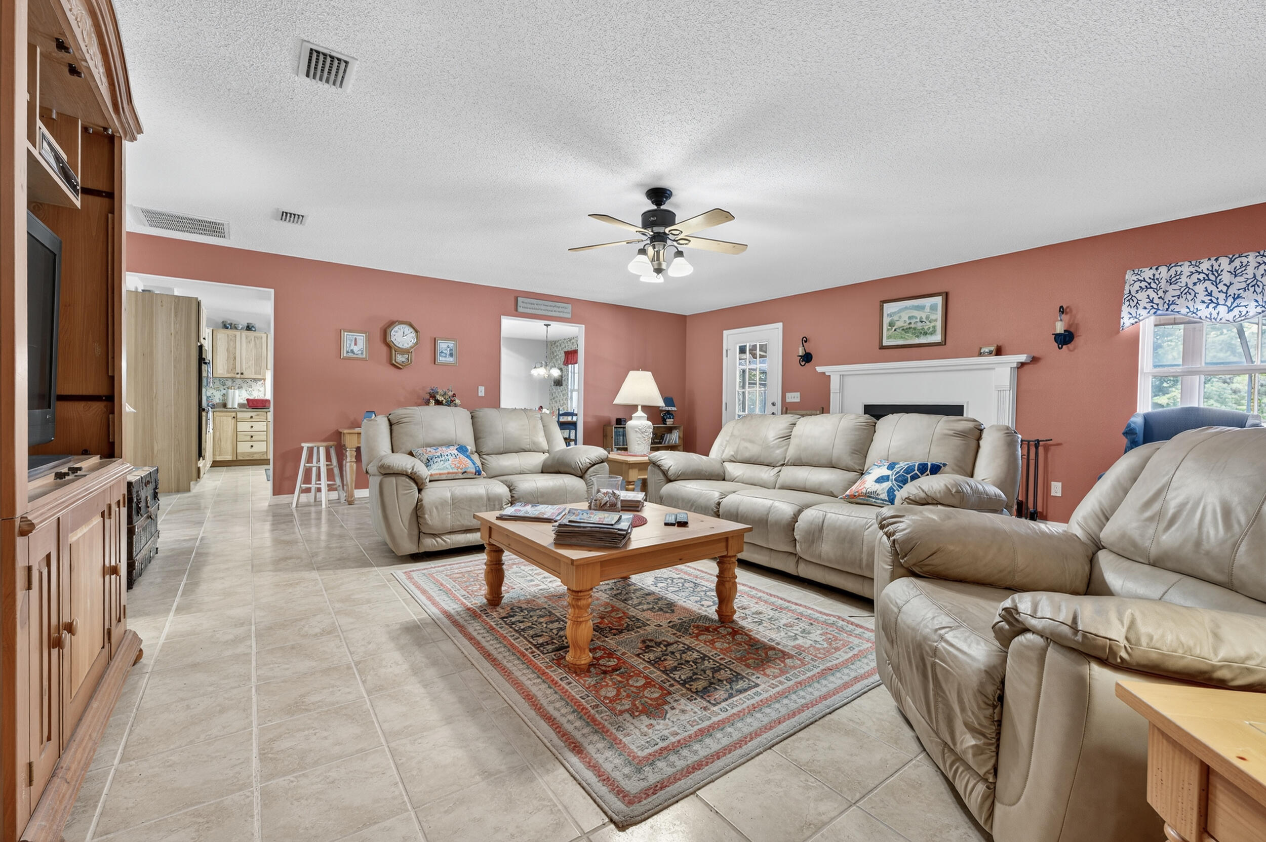 5378 Staghorn Road Crestview, FL 32539 - Photo 17 of 130 a living room with furniture and a flat screen tv