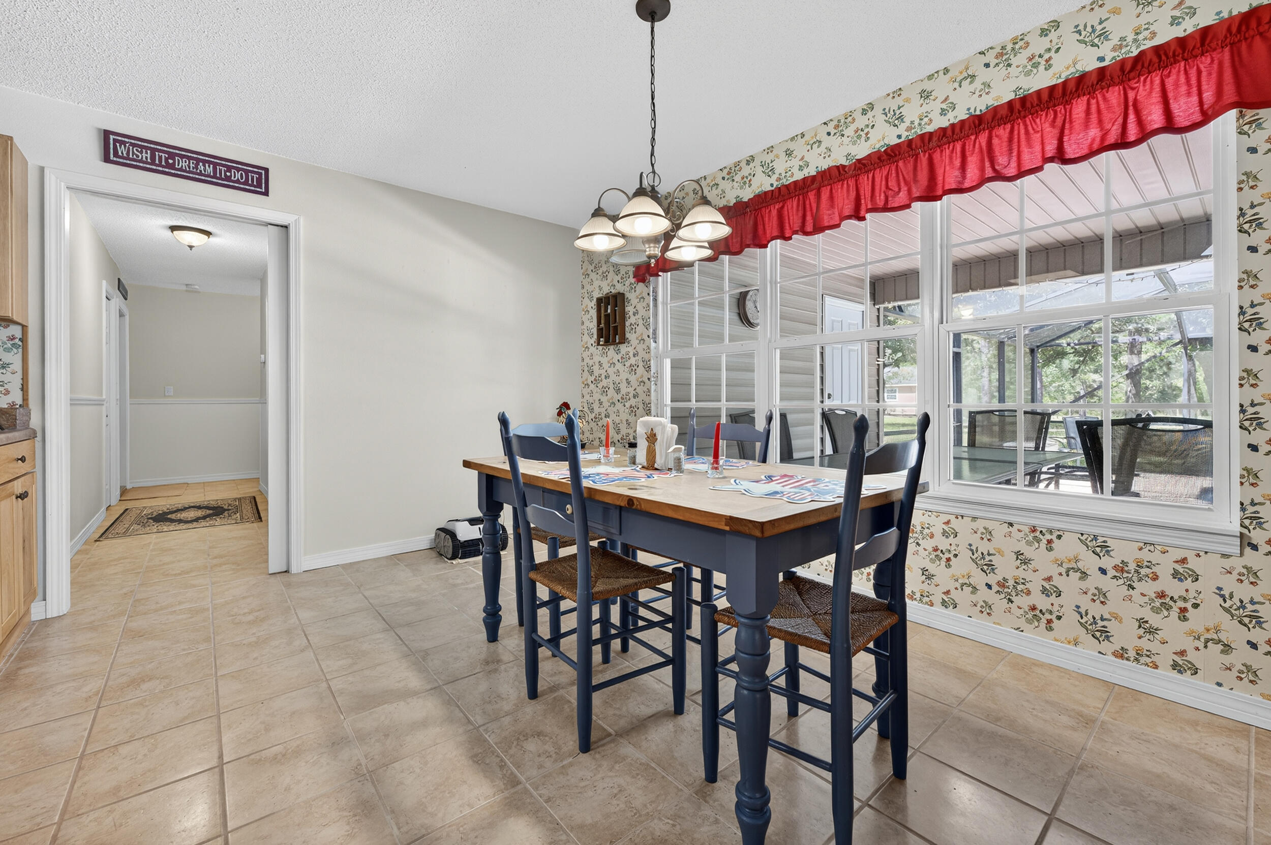 5378 Staghorn Road Crestview, FL 32539 - Photo 22 of 130 a view of a dining room with furniture and a chandelier