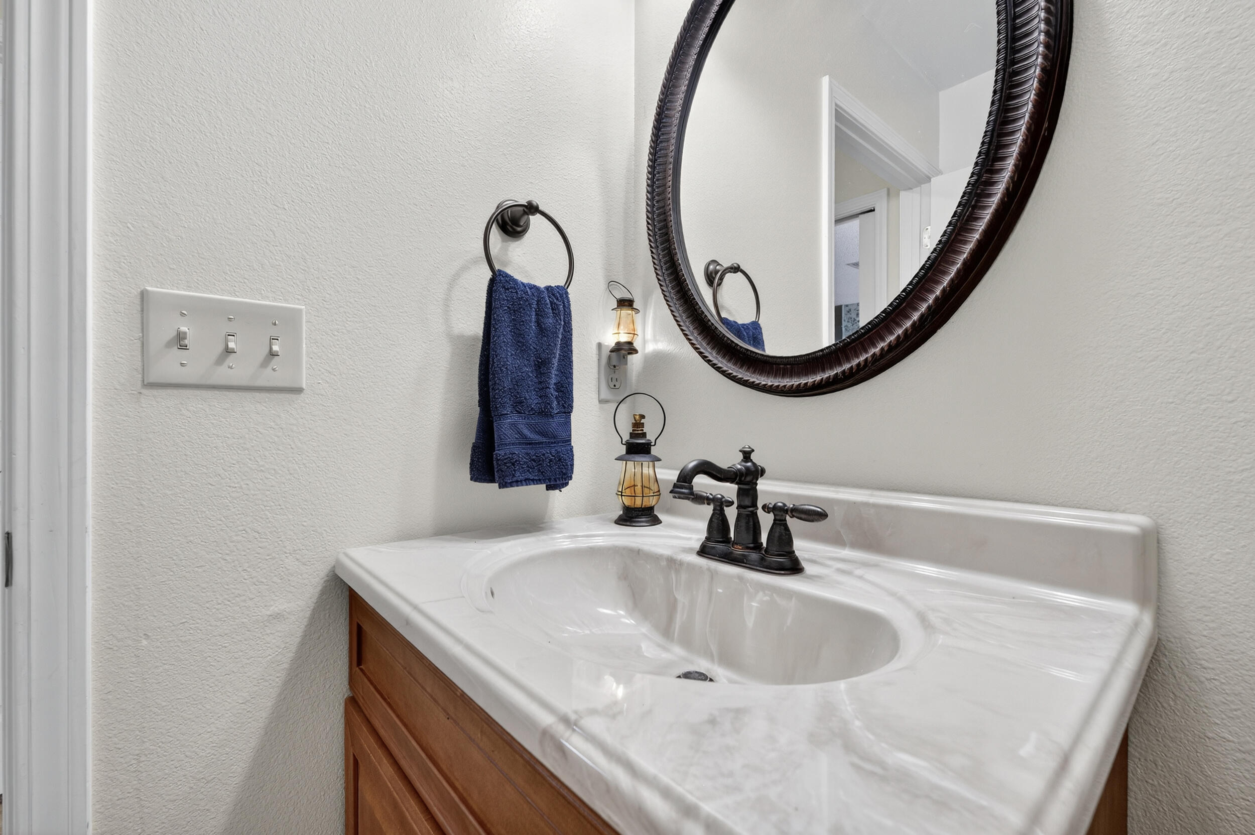 5378 Staghorn Road Crestview, FL 32539 - Photo 25 of 130 a bathroom with a sink and a mirror
